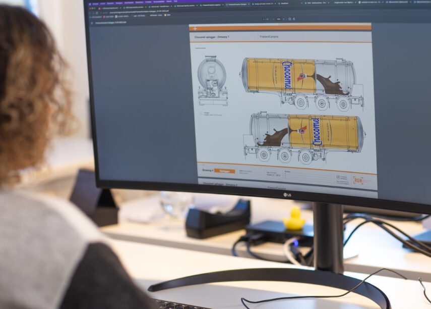 A person of RGN editing the design illustrations of a Chocomel tanker truck on a computer